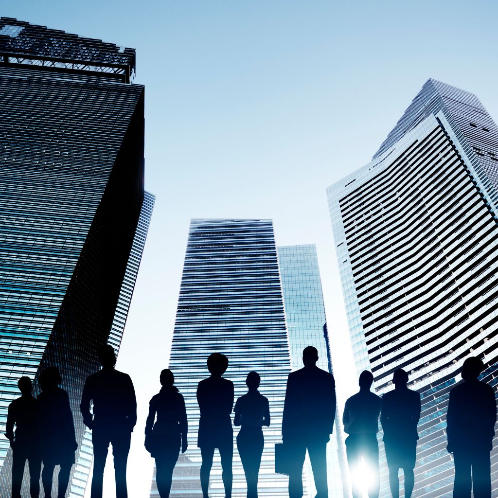 Custom AI agents for business by JFK Løvlien — a group of businesspeople silhouetted against corporate towers